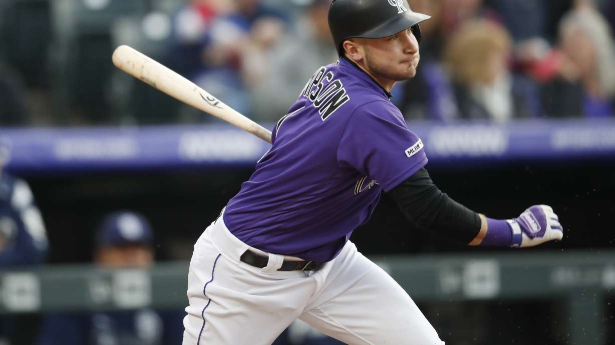 Marquez's arm, bat lead Rockies past Padres 12-2
