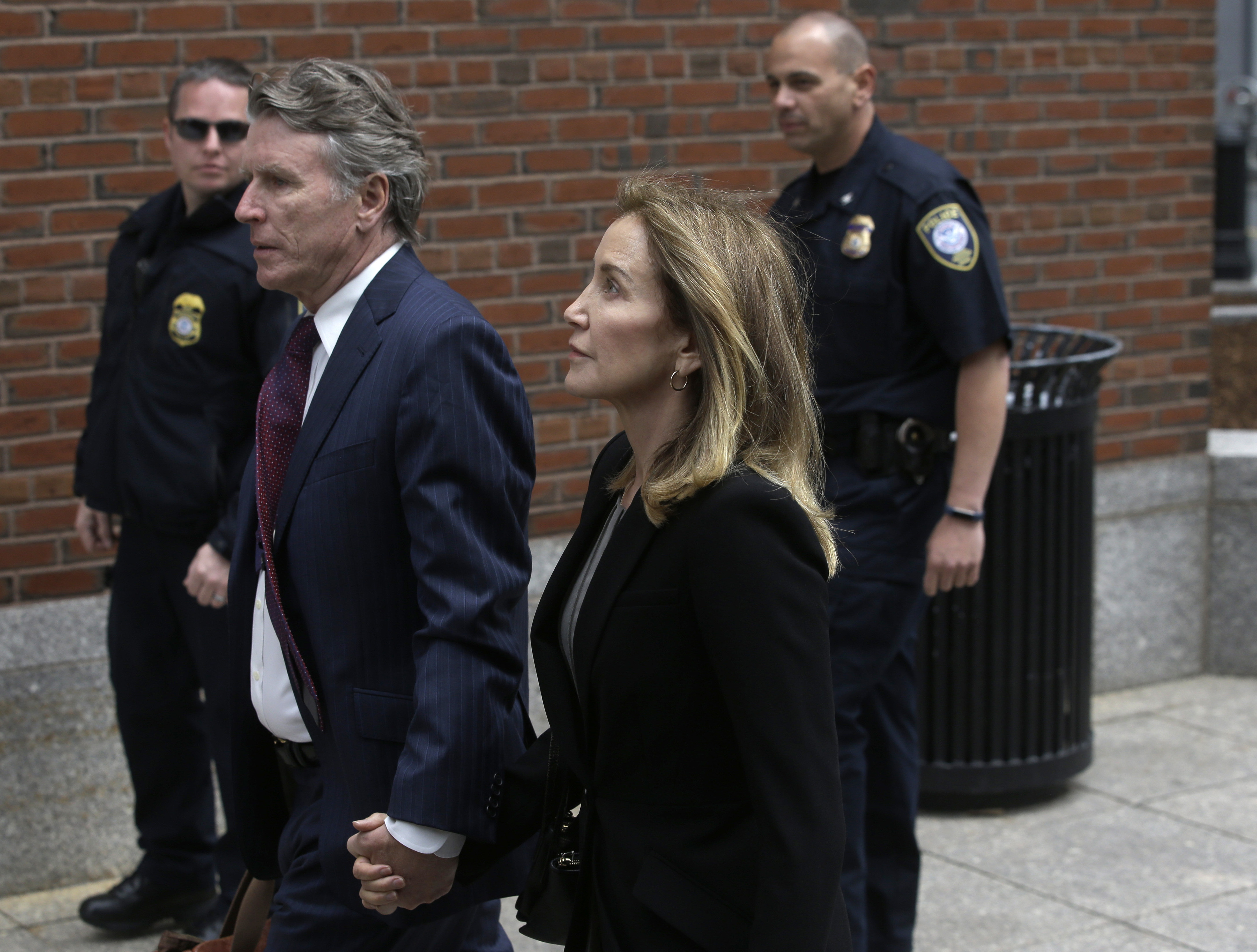 The Latest: Felicity Huffman pleads guilty in college scheme