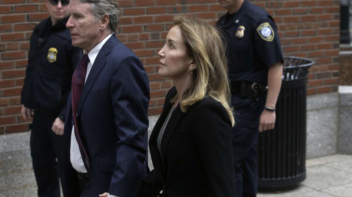 The Latest: Felicity Huffman pleads guilty in college scheme