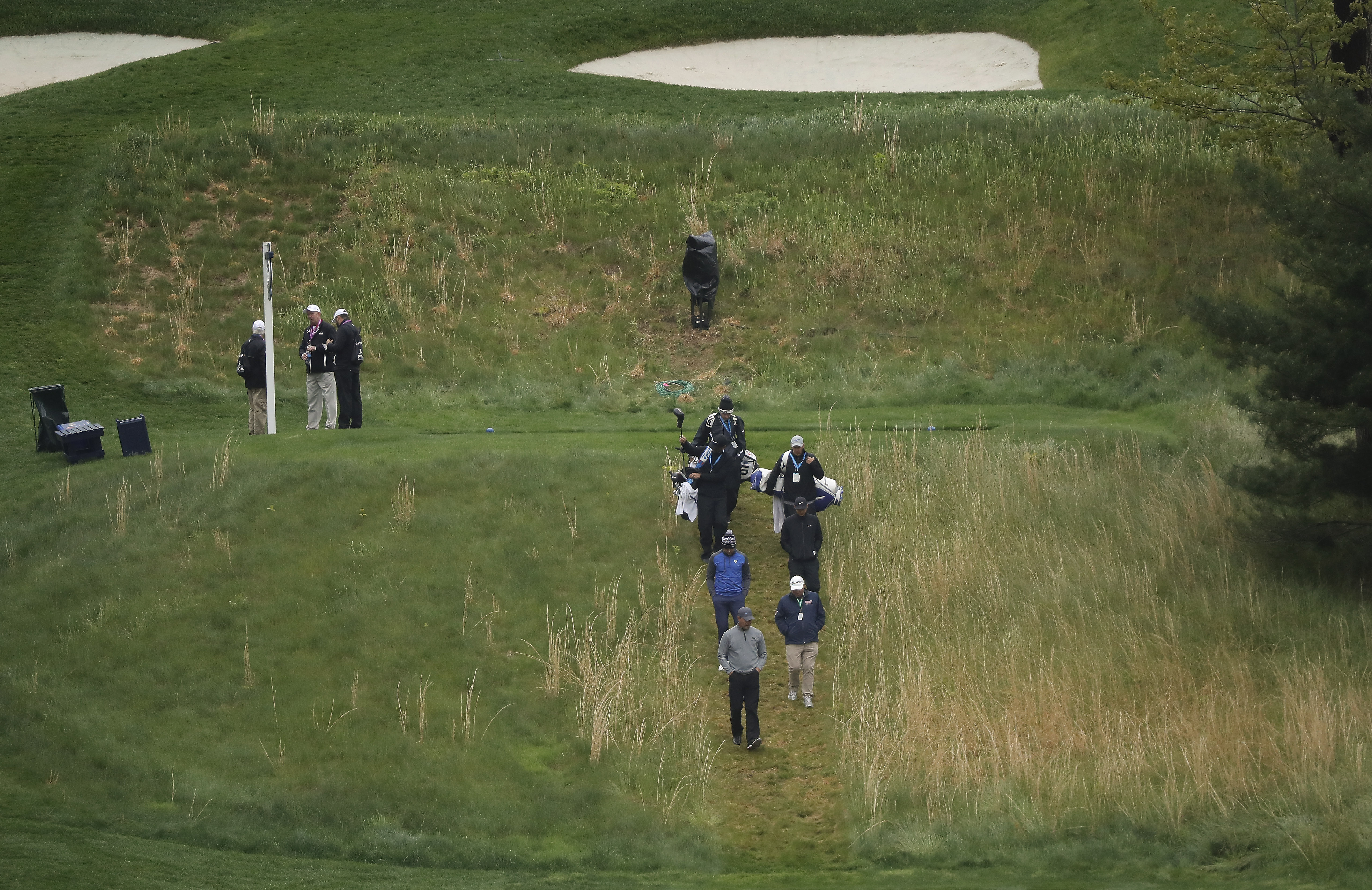 Bundle up at Bethpage as PGA Championship opens in cold rain