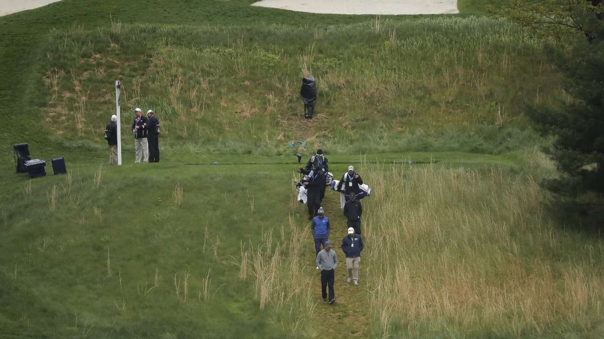 Bundle up at Bethpage as PGA Championship opens in cold rain