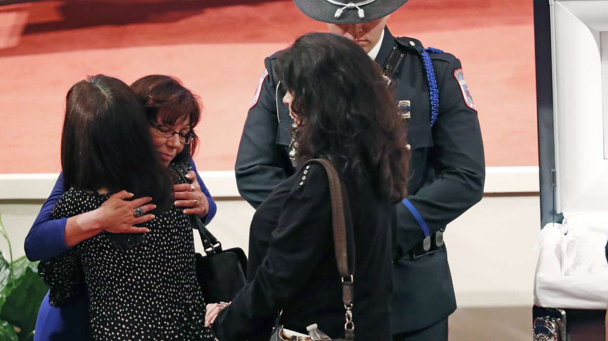 The Latest: Slain police officer called a 'man of integrity'