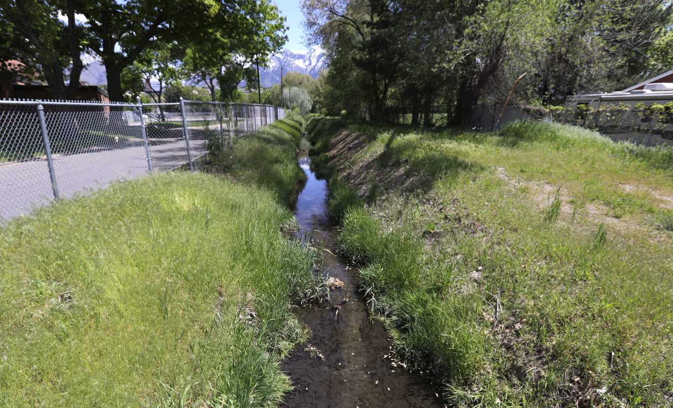 A canal north of Bear Park that will feature a future trail is pictured in Sandy on Monday, May 13, 2019. (Photo: Kristin Murphy, KSL)