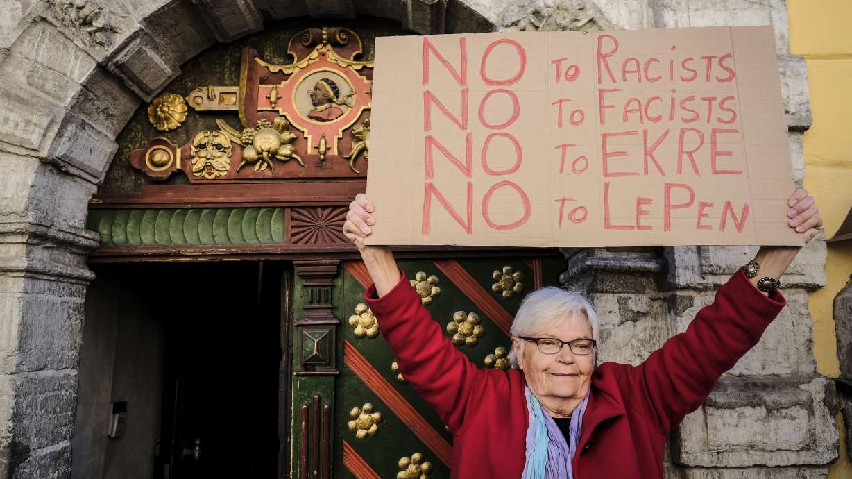 France's Le Pen put on spot over Russia while rallying right