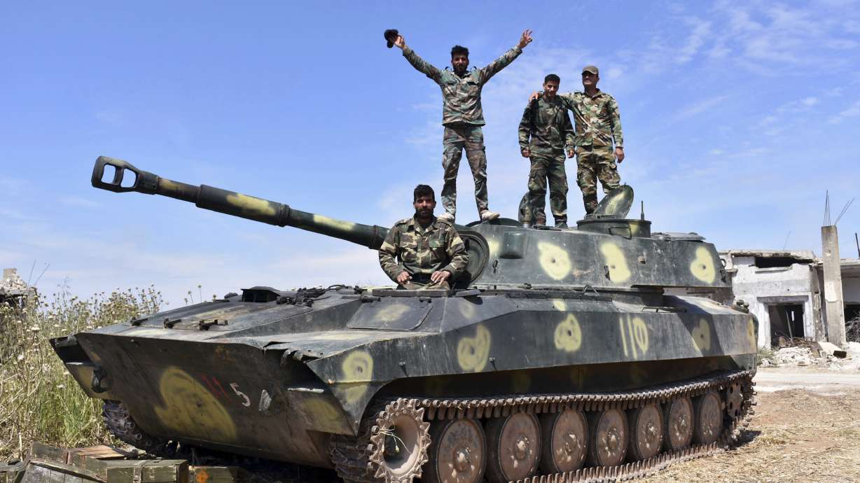 Syria TV says 6 killed in insurgent attack on displaced camp