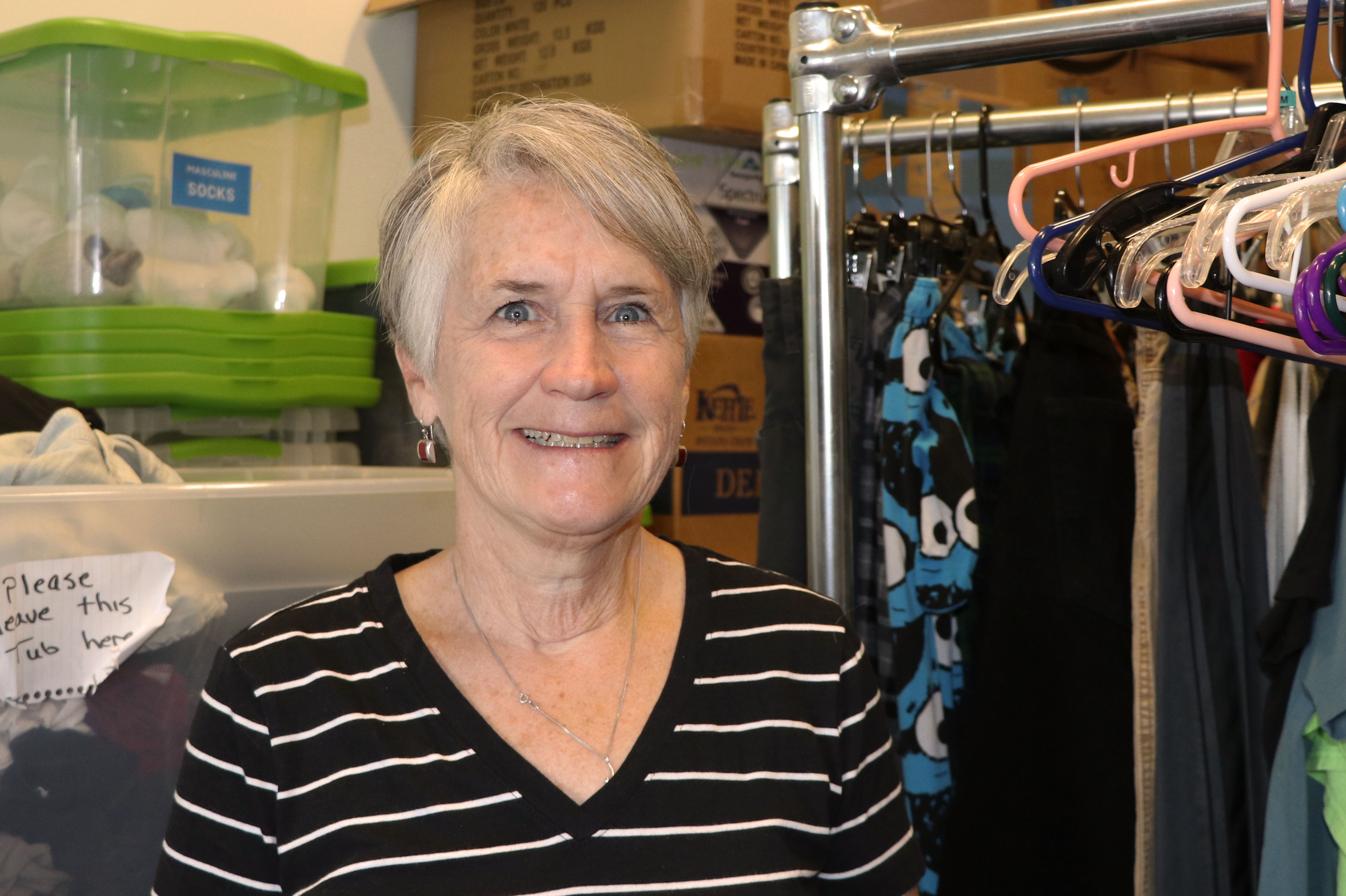 Diane Netelbeek poses for a photo in the Volunteers of America Youth Resource Center's supply room. Diane has been volunteering at the center for about two years. (Photo: Yvette Cruz, KSL.com)