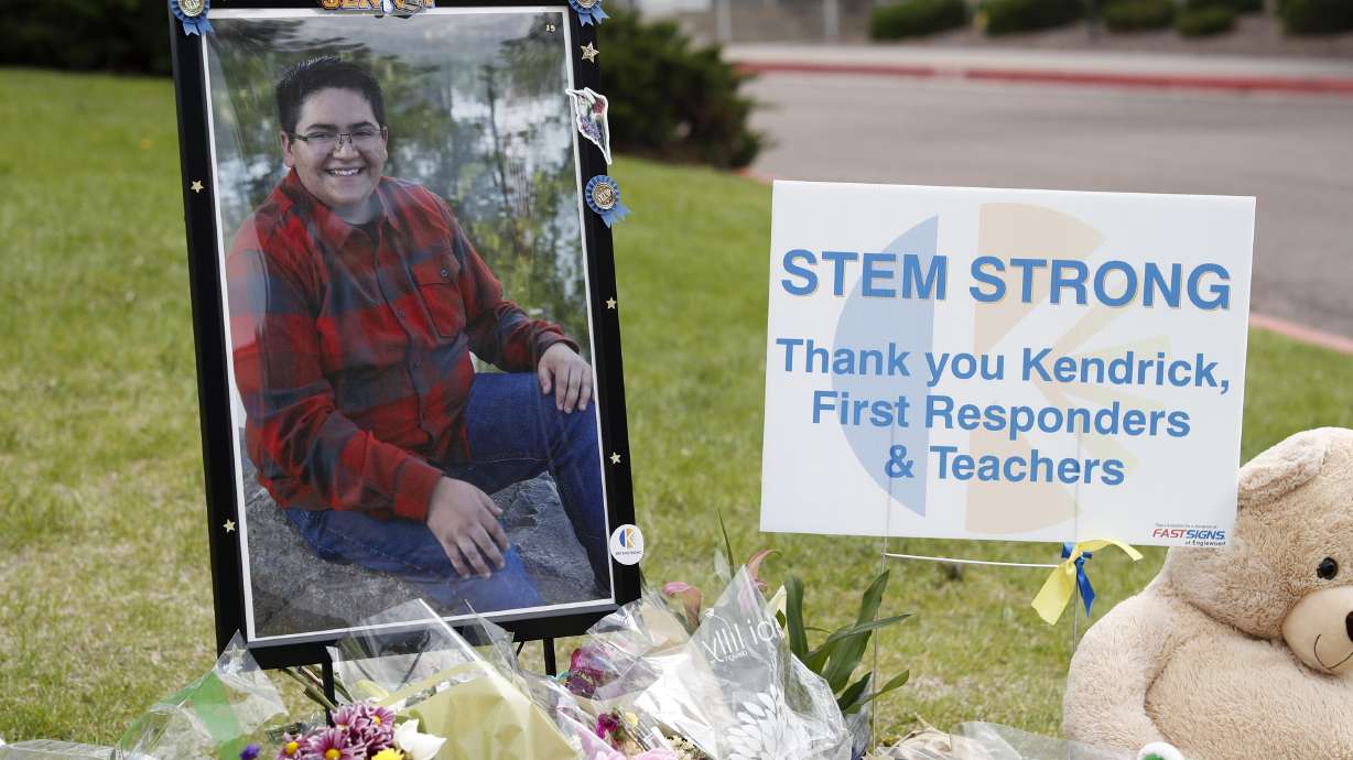 The Latest: Father of school shooting hero talks of love