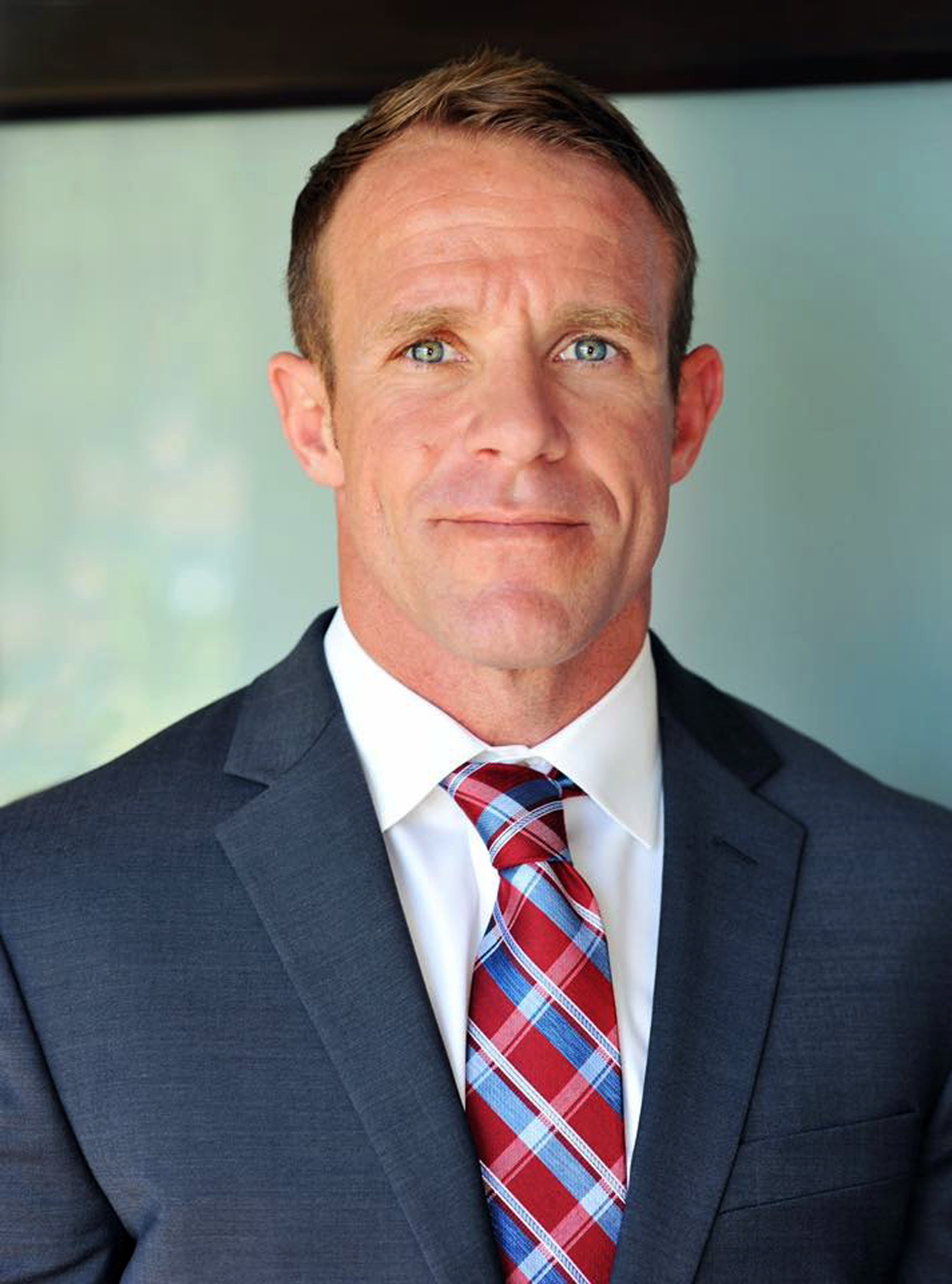 Defense seeks pause in Navy SEAL case while probing spying