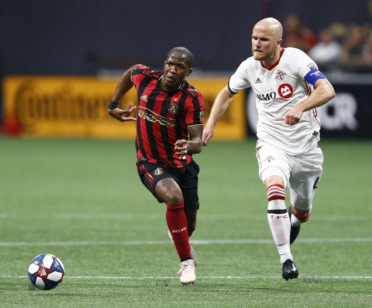 Atlanta United midfielder Darlington Nagbe, left, and Toronto FC midfielder Michael Bradley chase the ball during the first half of an MLS soccer match in Atlanta on Wednesday, May 8, 2019. (Photo: Mike Zarrilli, AP Photo)