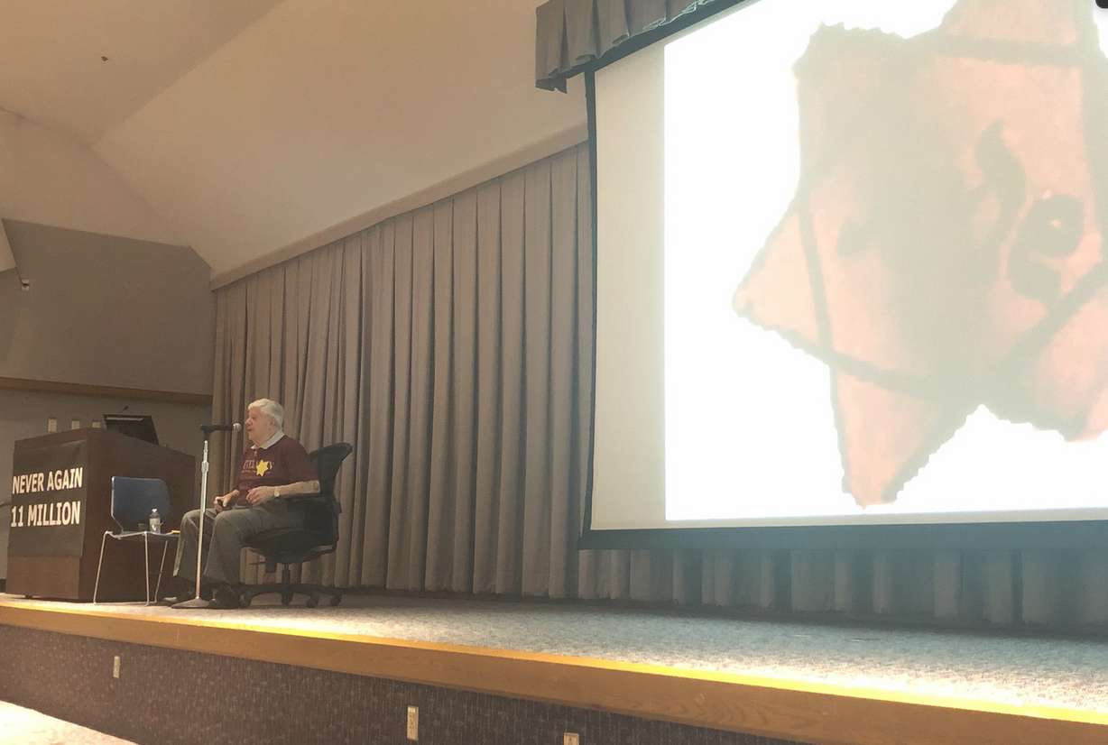 Holocaust survivor and author Stephen Nasser shows the "Yellow Badge" Nazis made him, his family and all Jewish members in his community had to wear in the ghettos before they were taken to Auschwitz in 1943. (Photo: Carter Williams, KSL.com)