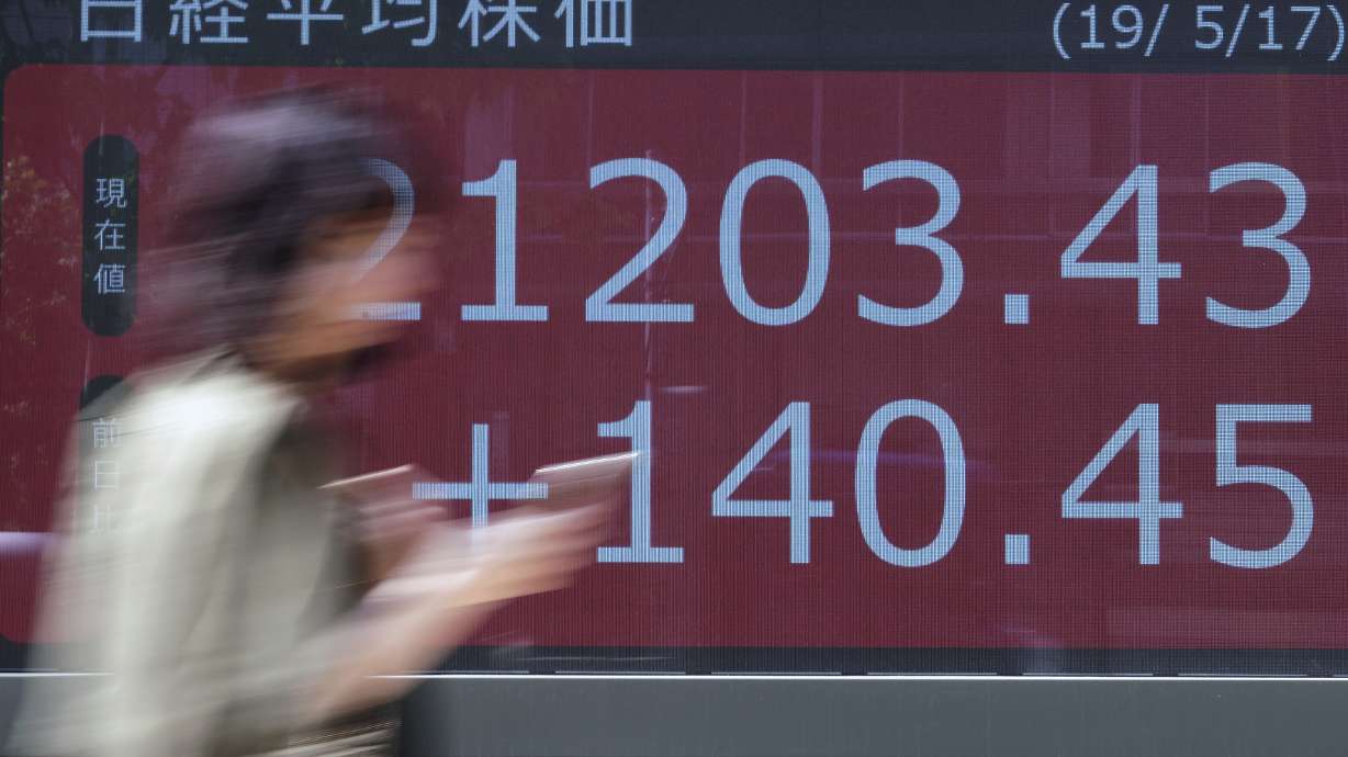 World shares fall as Huawei sanctions stir trade fears