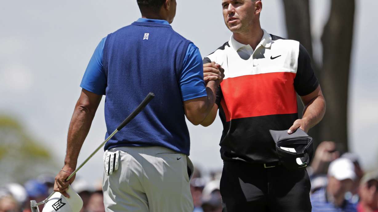 The Latest: Tiger on wrong side of cut at PGA Championship