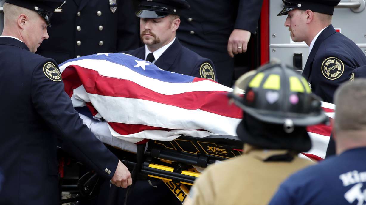 The Latest: Man in Wisconsin shooting faced drug charges