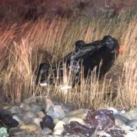 Tooele county man pulls woman from partially submerged car