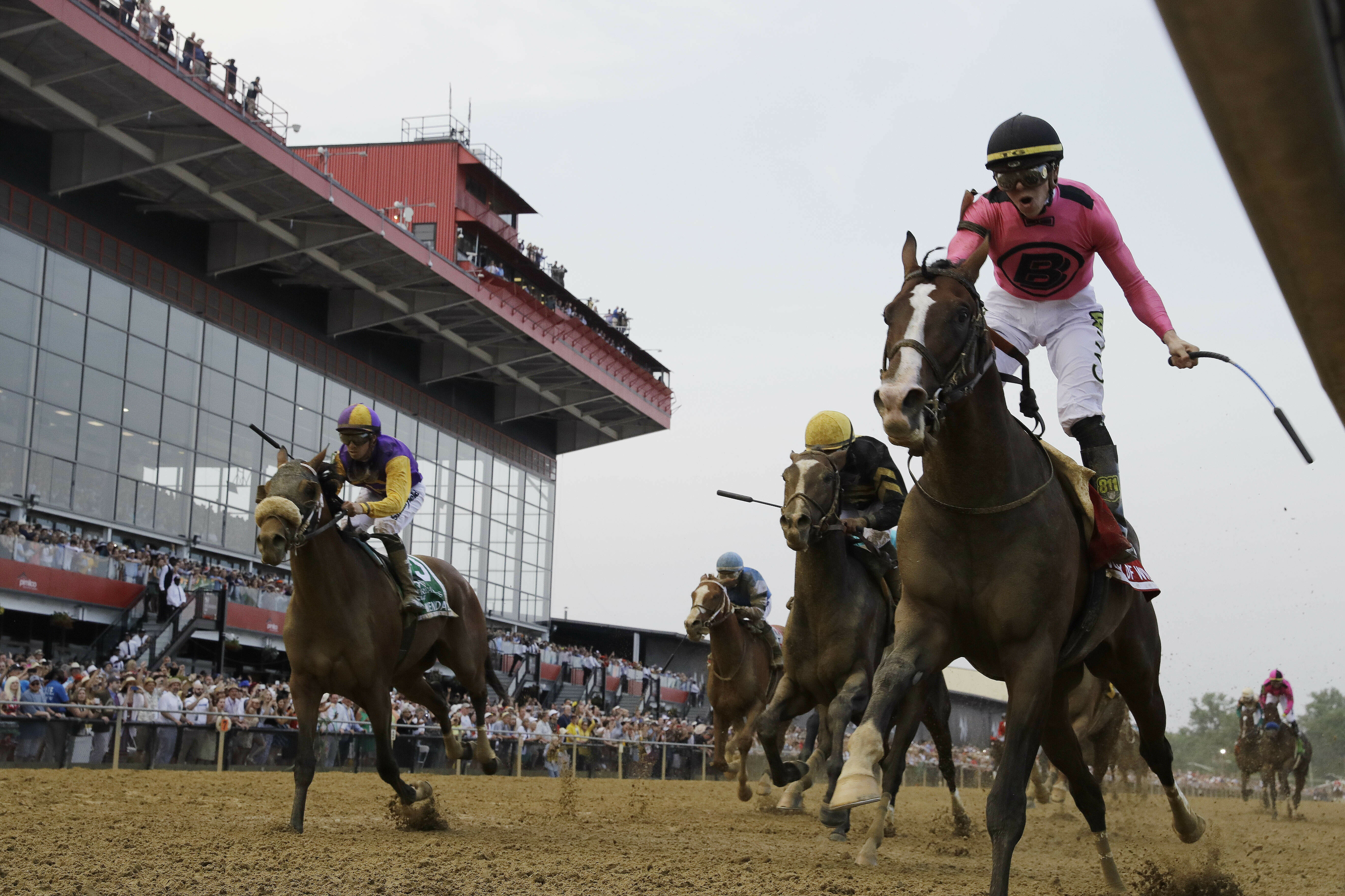 War of Will, ridden by Tyler Gaffalione, right, crosses the finish line first to win the Preakness Stakes horse race at Pimlico Race Course, Saturday, May 18, 2019, in Baltimore. (Photo: Steve Helber, AP)