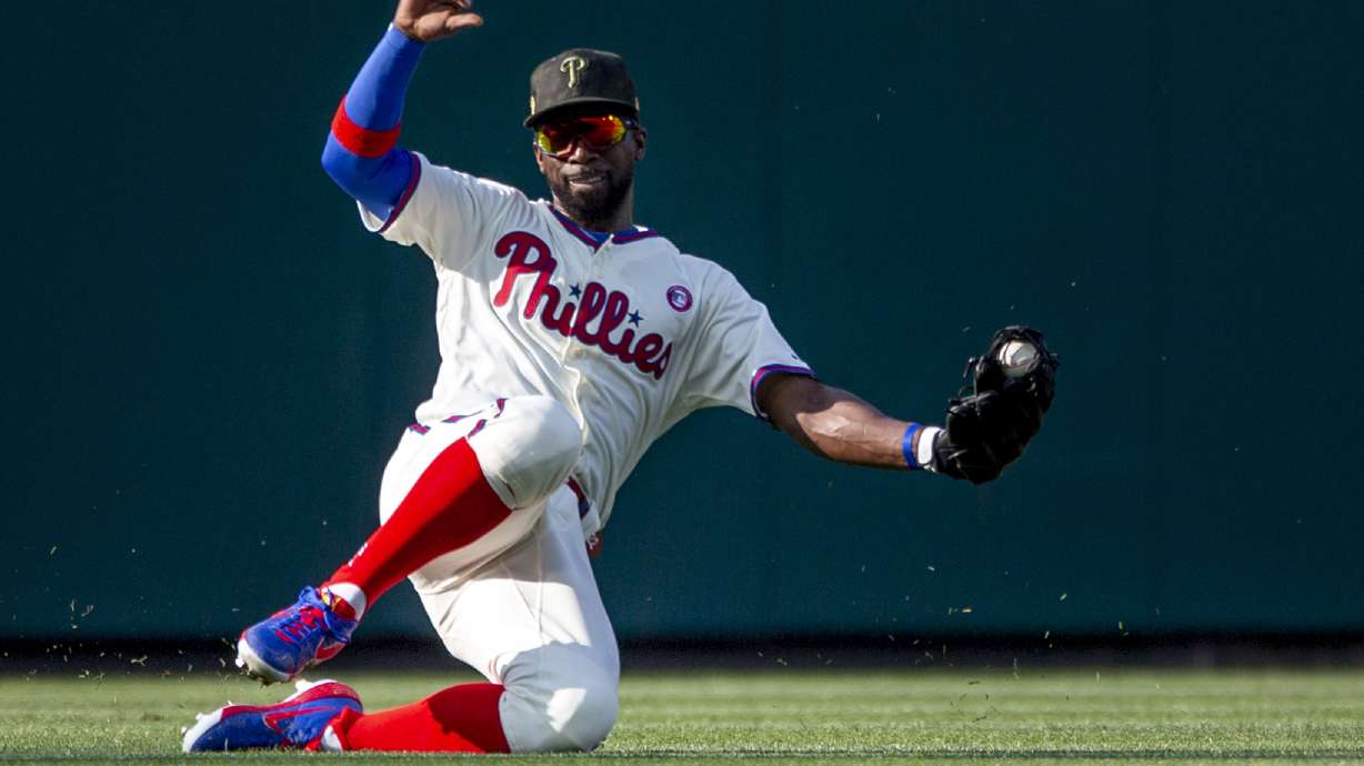 Harper's bat, Nola's arm lead Phillies past Rockies 2-1
