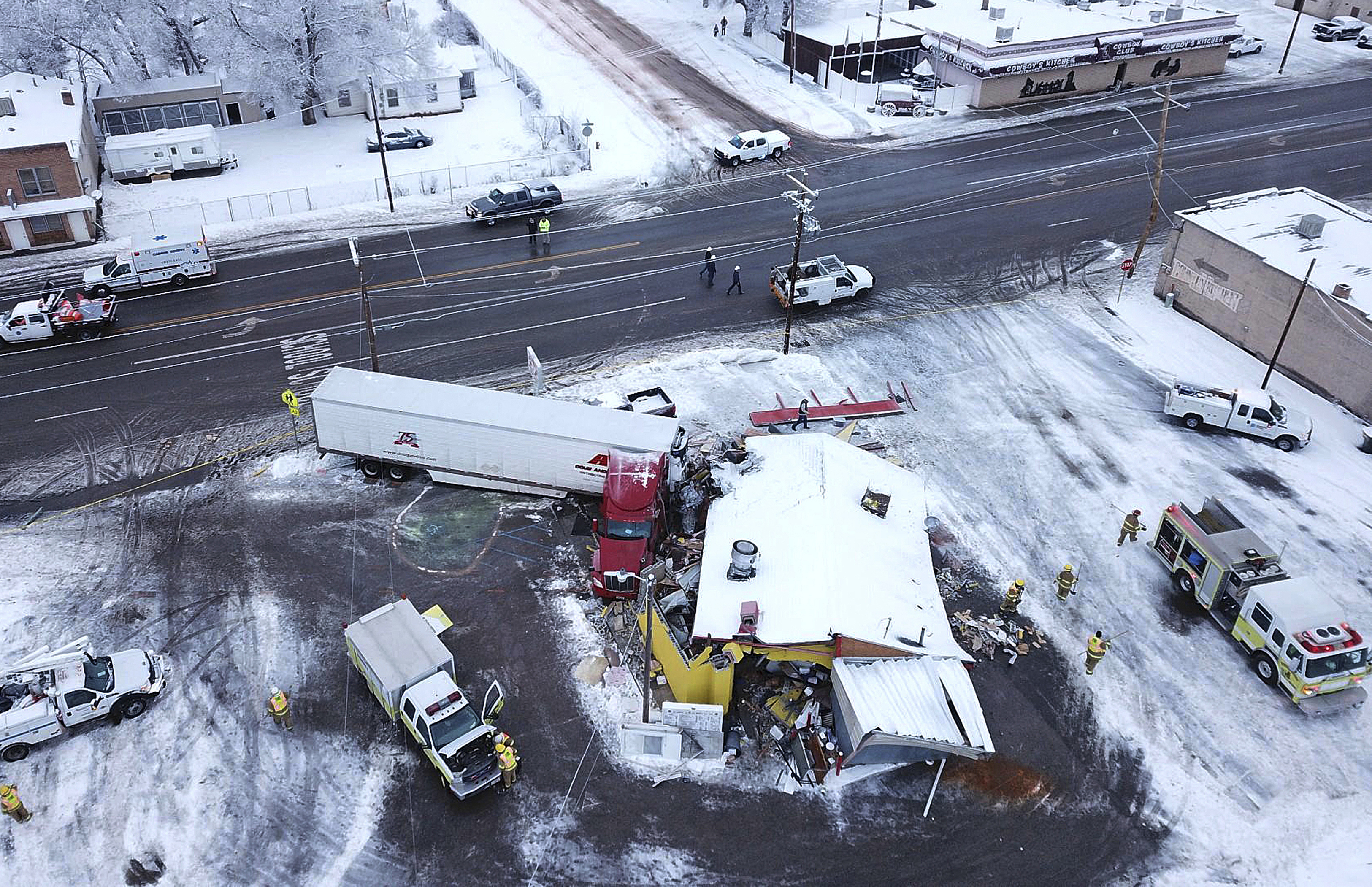 FILE - This Jan. 16, 2019 photo taken by a Utah Highway Patrol drone shows a big rig that has crashed into a resaturant in Wellington, Utah. In Utah, drones are hovering near avalanches to measure roaring snow. Photo: Utah Highway Patrol via AP