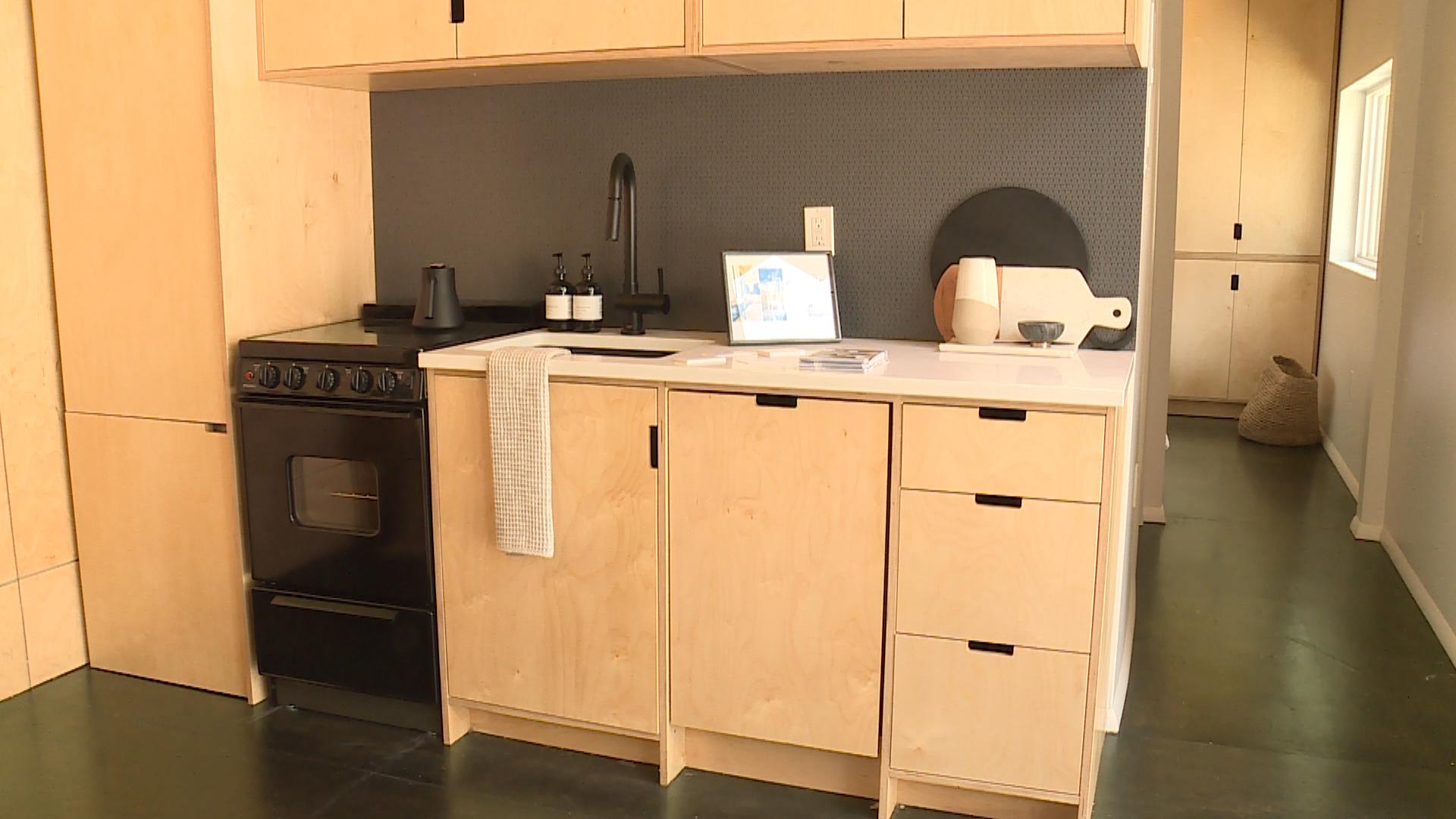The kitchen inside a Modal Living model tiny house on display at City Creek Center. (Photo: Winston Armani, KSL TV)
