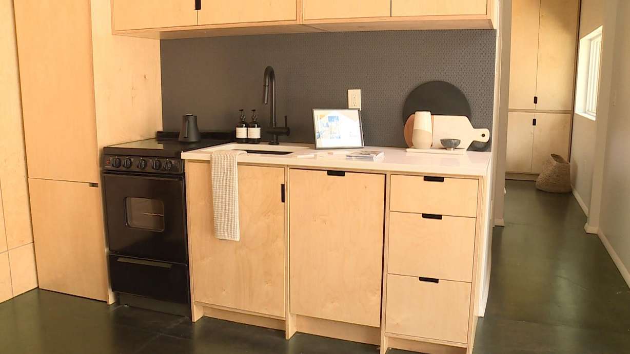 The kitchen inside a Modal Living model tiny house on display at City Creek Center. (Photo: Winston Armani, KSL TV)