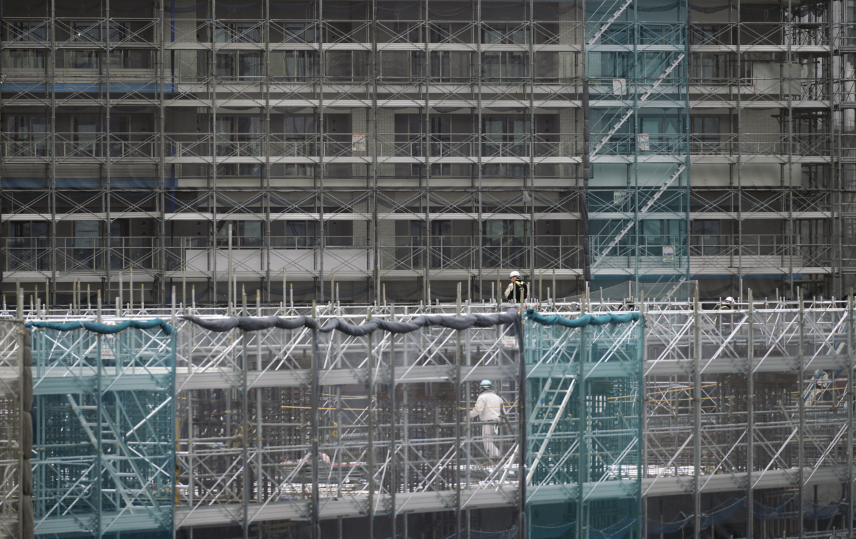 IOC confident Tokyo can resolve complaints over budget cuts