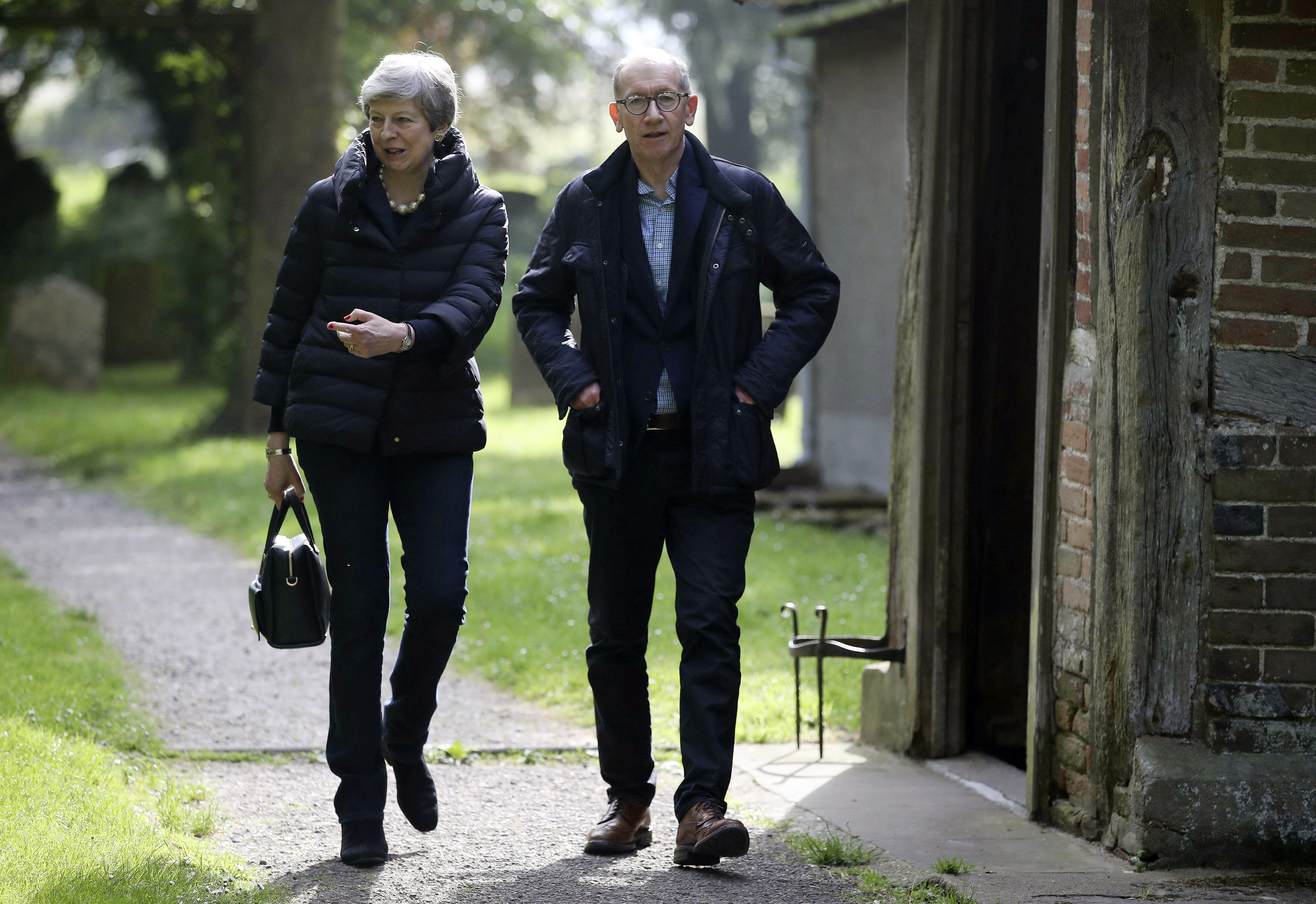 Seeking Brexit support, May offers vote on new referendum