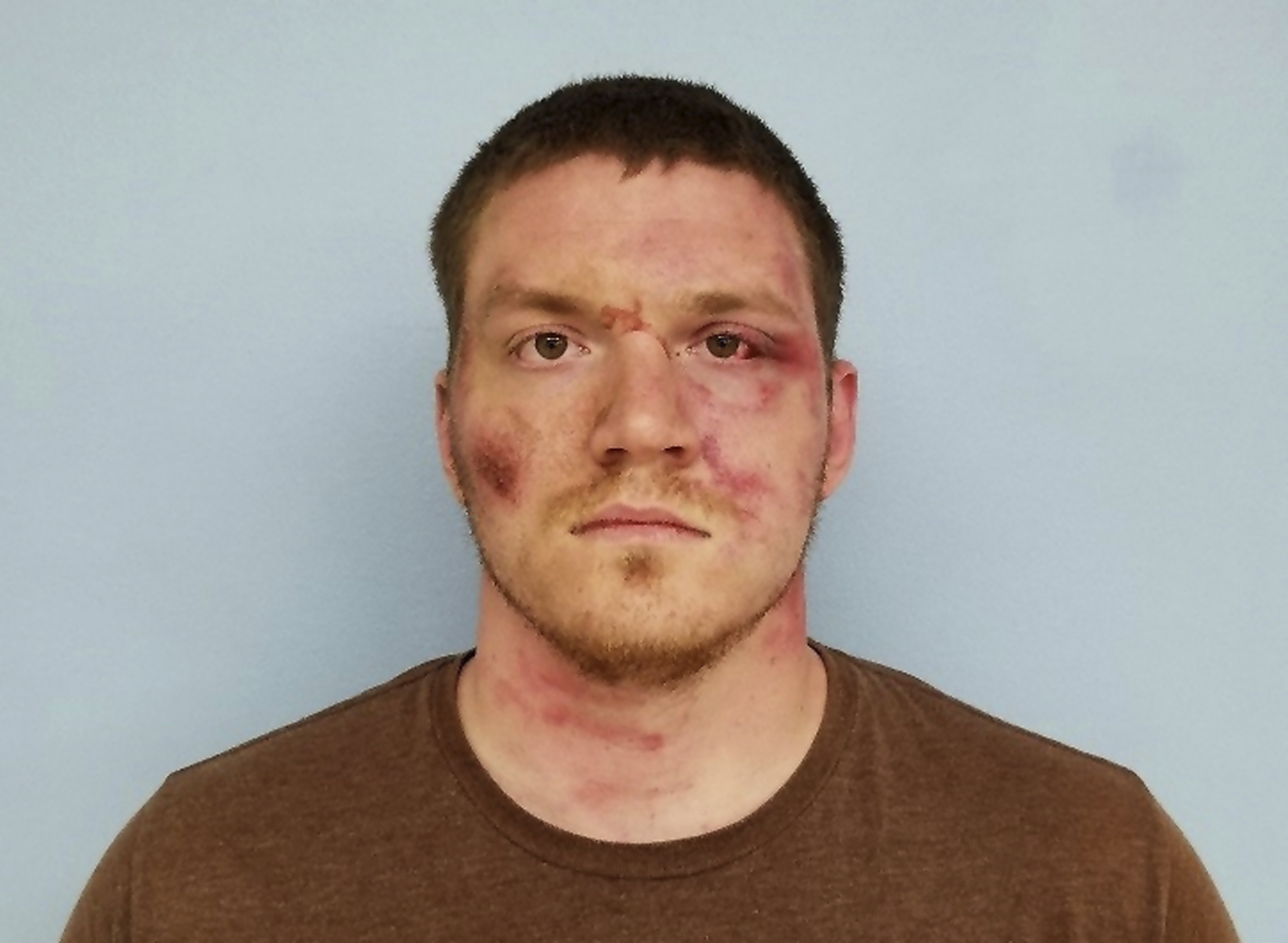 The Latest: Police shooting suspect appears in court