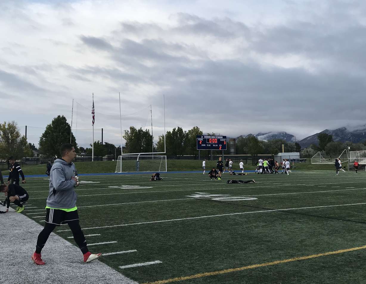 Wasatch players collapse as Olympus holds on for a 3-2 win in a Class 5A state semifinal, Tuesday, May 21, 2019 at Juan Diego High School. (Photo: Sean Walker, KSL.com)