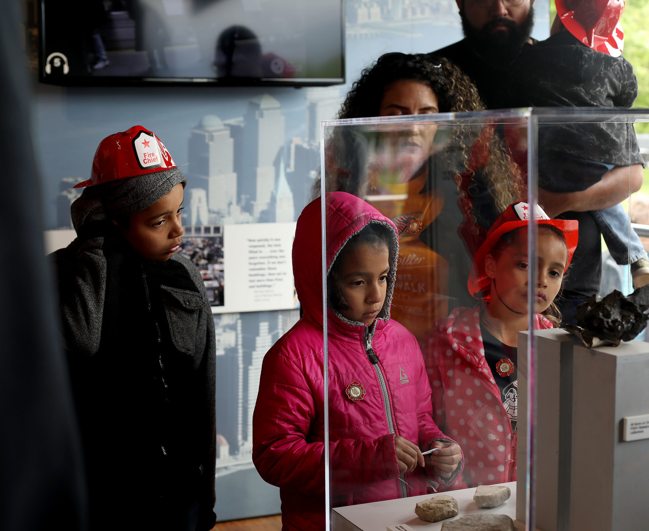 Children look at artifacts collected from the grounds of Manhattan’s World Trade Center at the 9/11 Never Forget Mobile Exhibit at Centennial Park in West Valley City on Thursday, May 23, 2019. (Photo: Laura Seitz, KSL)