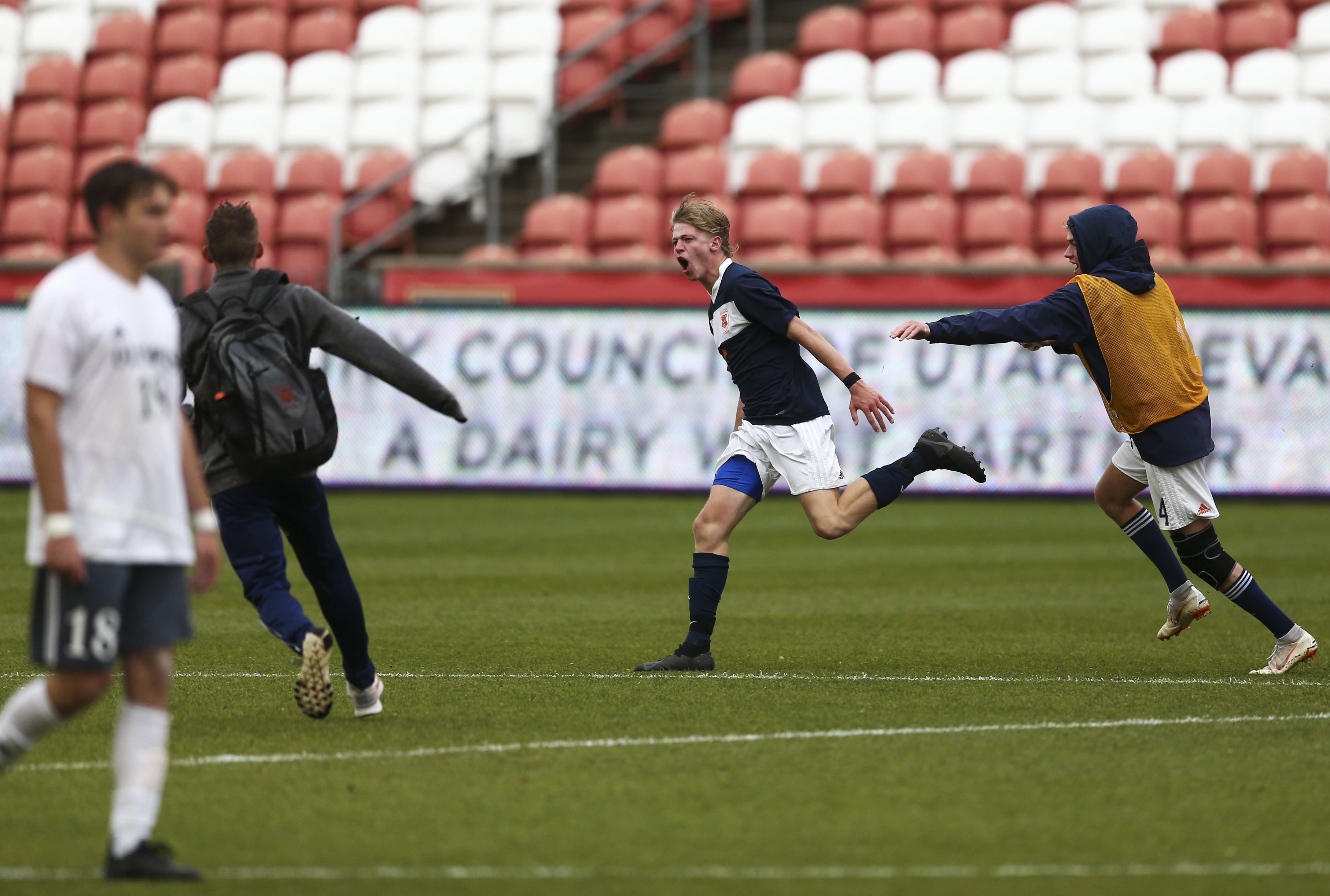 Brighton High School Braxton Jones (5) runs across the field celebrating after scoring the game-winning goal against Olympus High School in overtime during the UHSAA 5A Soccer Championship game at Rio Tinto Stadium in Sandy on Thursday, May 23, 2019. (Silas Walker, KSL)