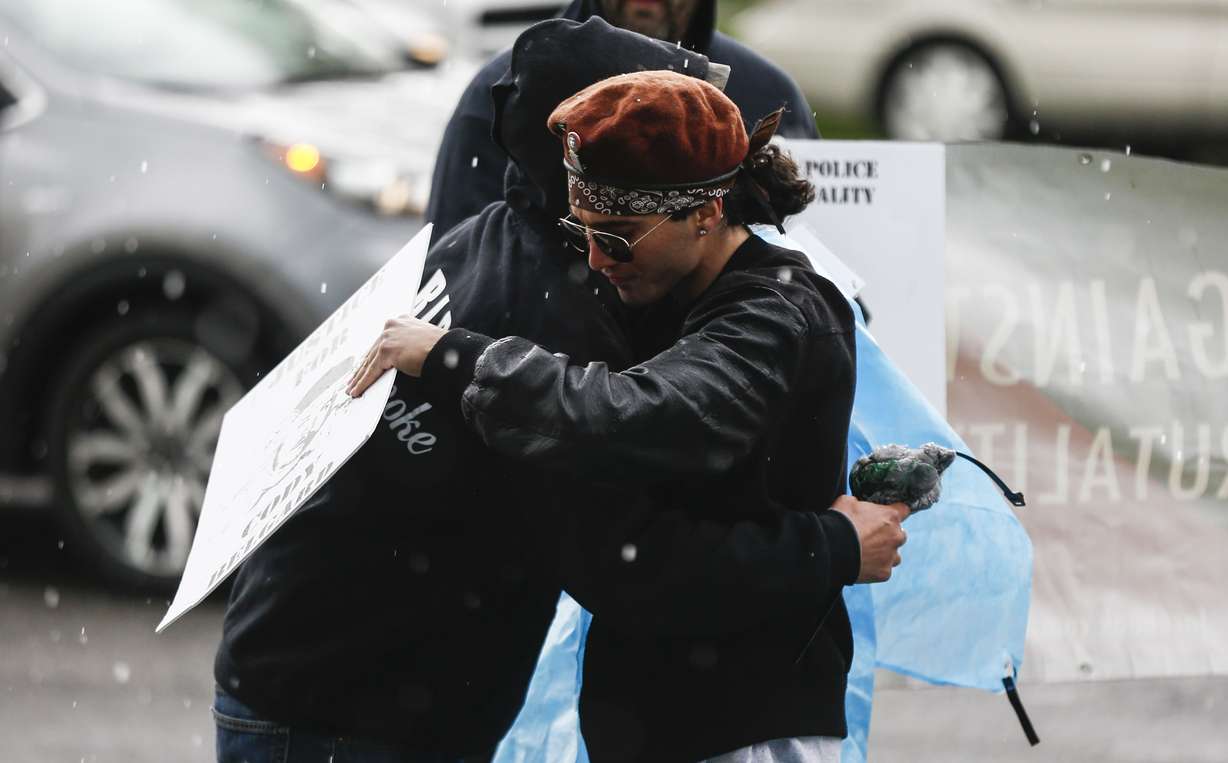 Protesters demonstrate outside the Salt Lake County District Attorney’s Office in Salt Lake City on Friday, May 24, 2019. The protesters laid on the grass in bags with nametags of individuals killed by police. (Photo: Silas Walker, KSL)