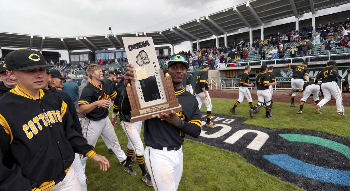 Cottonwood shortstop Daniel Gonzalez takes his turn holding the championship trophy as Cottonwood defeats Timpanogos for the 5A high school baseball championship at the UCUU ball park in Orem on Friday, May 24, 2019. (Photo: Steve Griffin, KSL)
