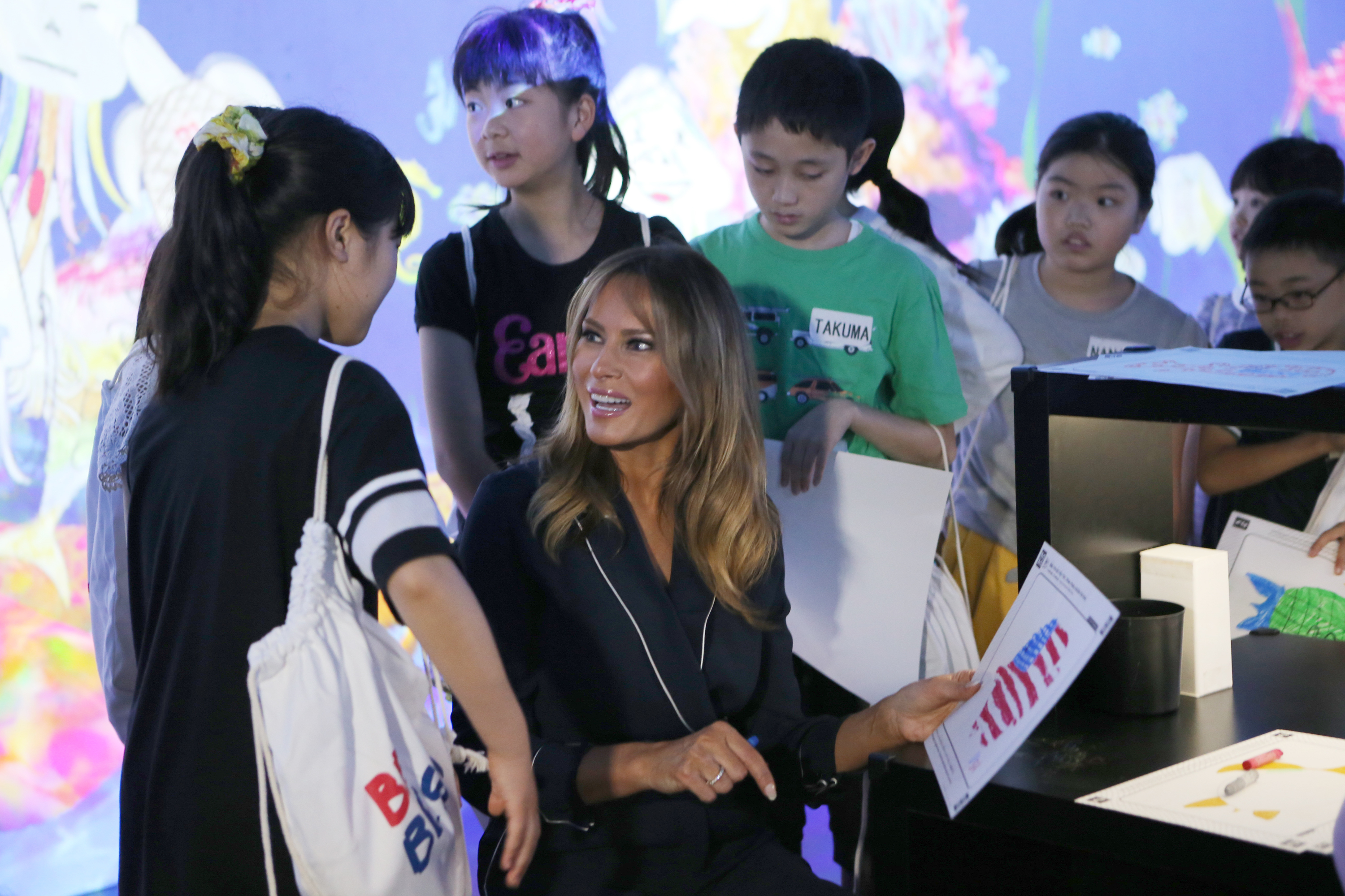 Melania Trump colors fish with kids at Japan digital museum