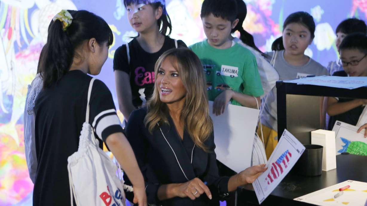 Melania Trump colors fish with kids at Japan digital museum