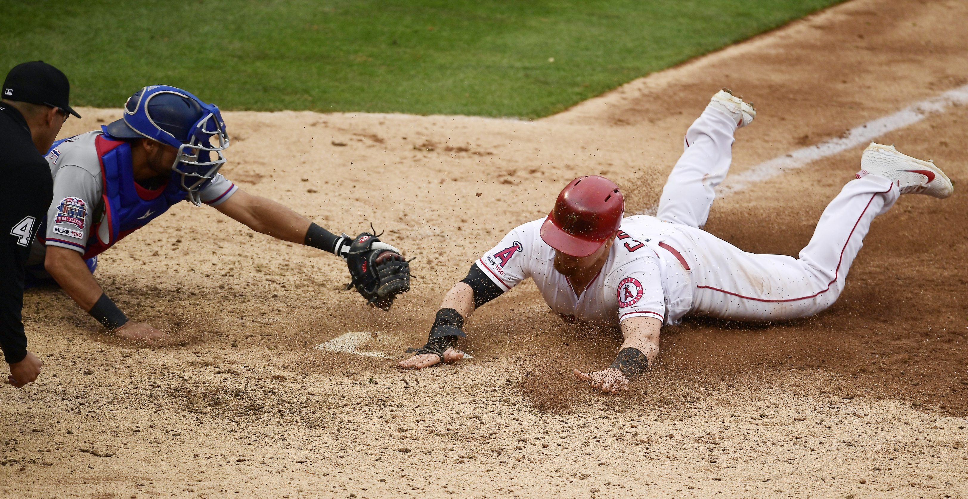 Trout homers, Angels rally for 6 in 7th to edge Rangers 7-6