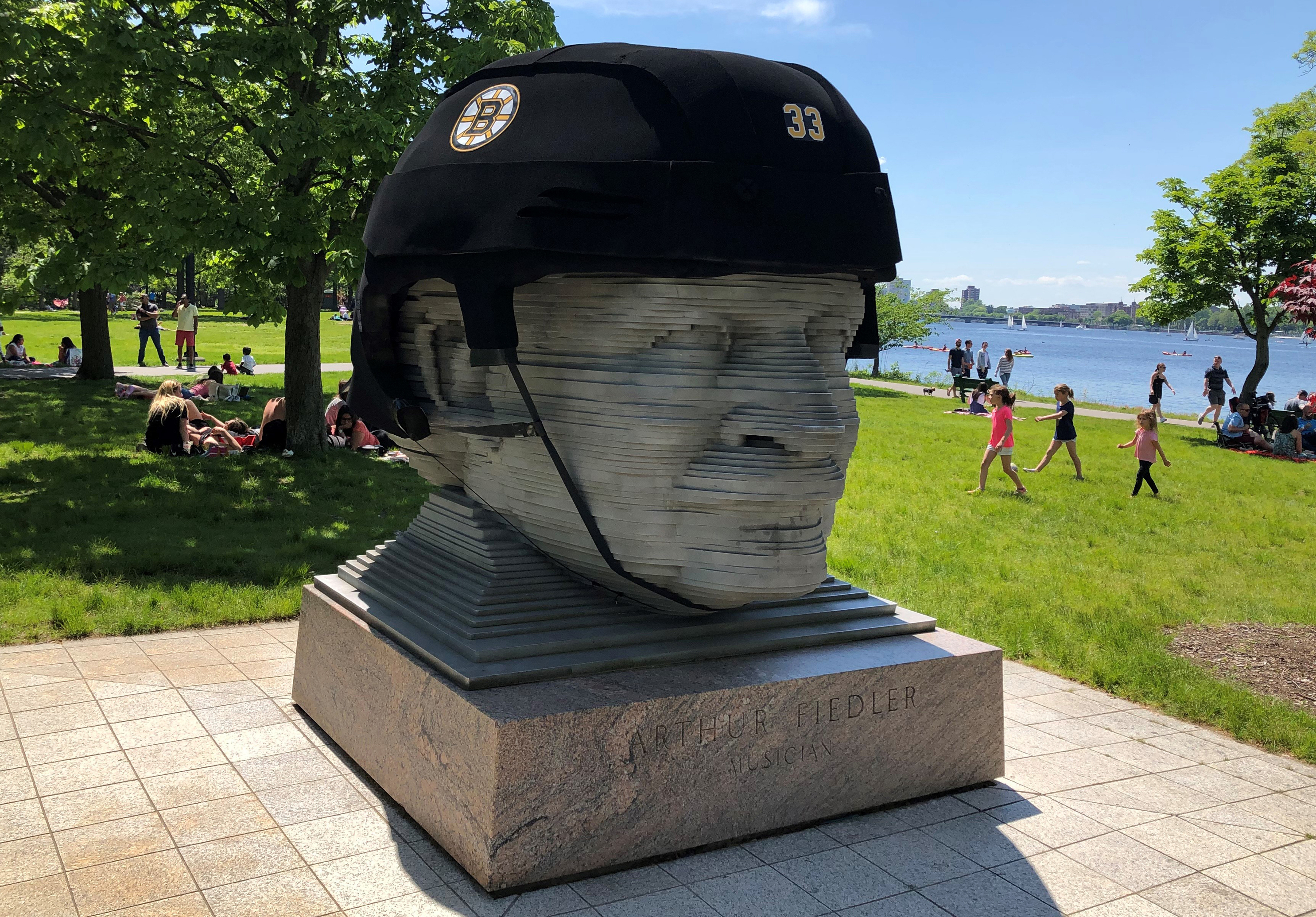 Famed Boston maestro's statue sports giant Bruins helmet