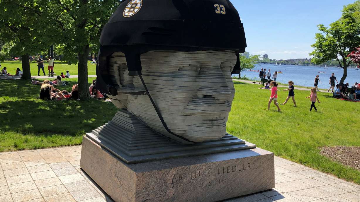 Famed Boston maestro's statue sports giant Bruins helmet