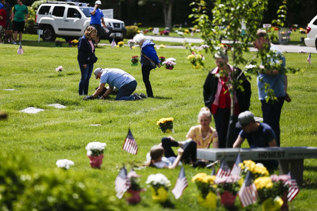 People visit the burial sites of their loved ones during Memorial Day at Wasatch Lawn Memorial Park in Salt Lake City on Monday, May 27, 2019. (Photo: Silas Walker, KSL)