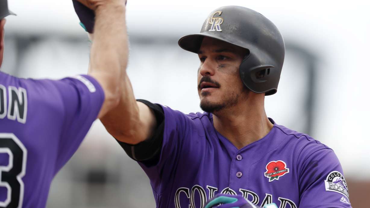 Tapia singles in winning run in 11th, Rox beat D'backs 4-3