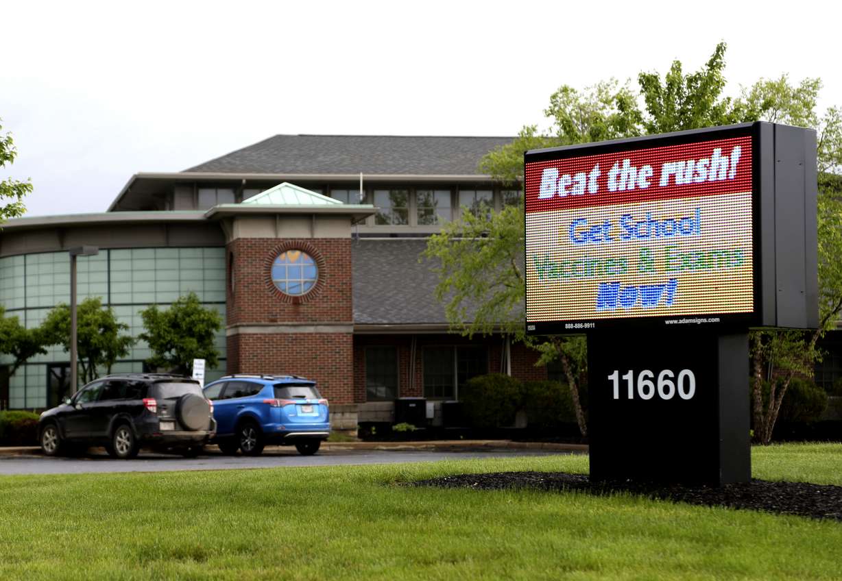 In this Friday, May 17, 2019 a sign stands advertising school vaccines and physical exams sits in front of the Knox County Health Department in Mount Vernon, Ohio. Photo: Paul Vernon, AP Photo