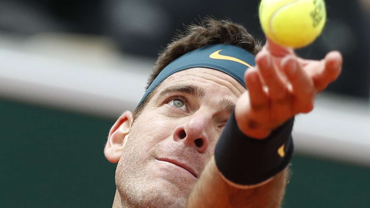 The Latest: Halep advances in 3 sets at French Open