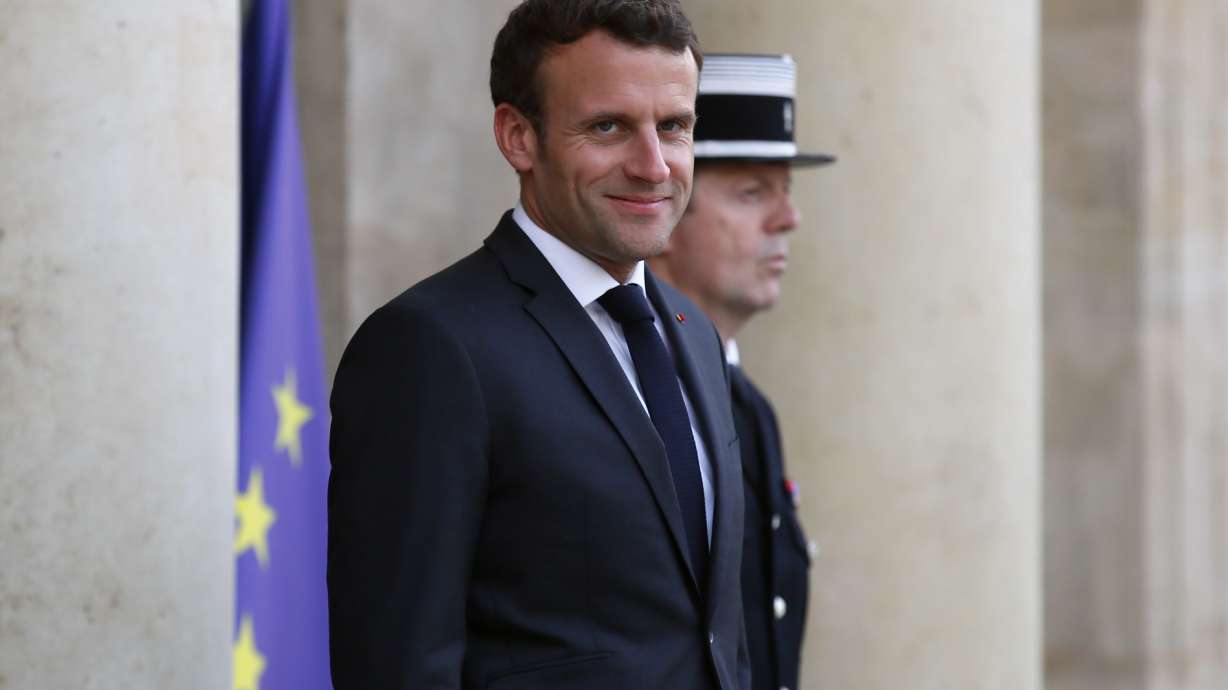 Climate activists on trial for taking down Macron portraits