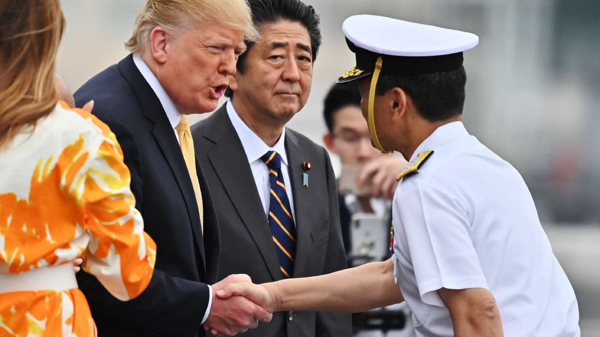 Flattery in Japan in rearview, Trump returns to DC snarls