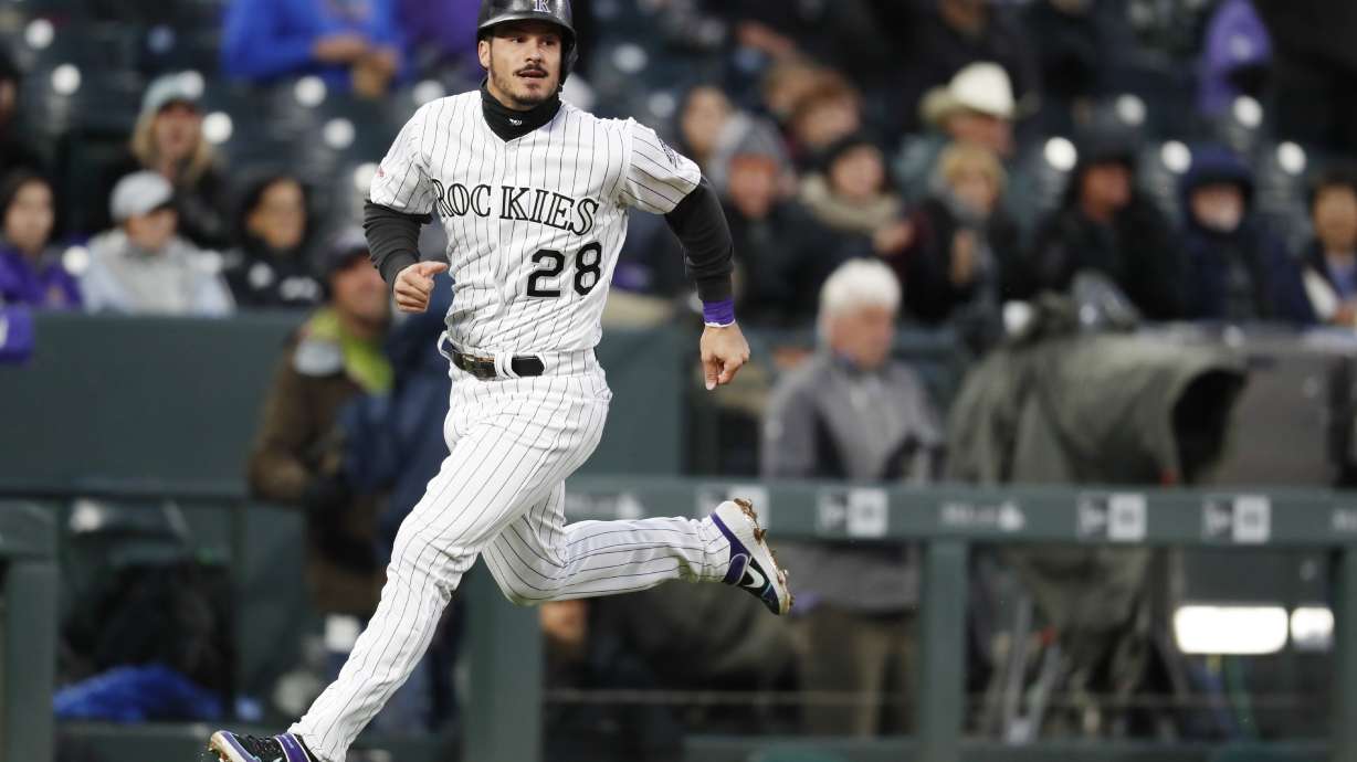 Iannetta homers in 7th, Rox beat D'backs 6-2 on rainy night