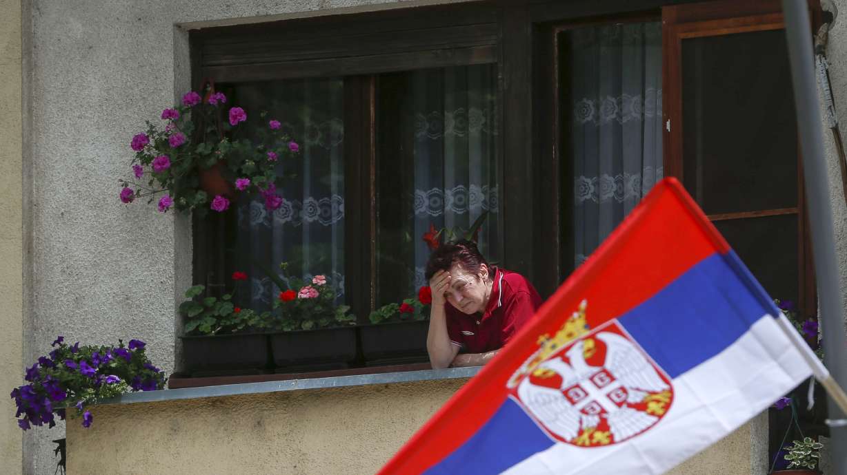 The Latest: Scuffles at Serbia-Kosovo event in Belgrade