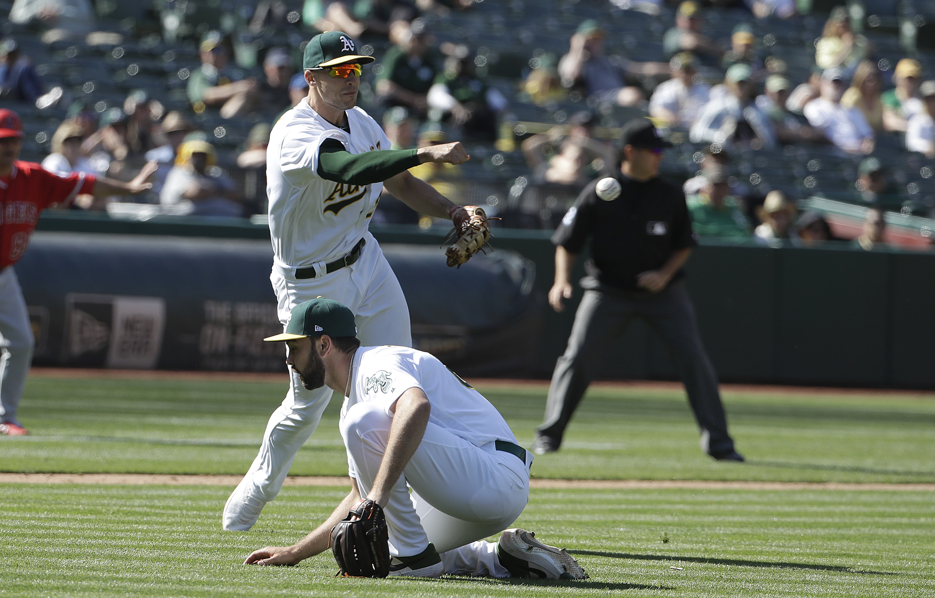 Angels benefit from rare error by Olson to beat A's 12-7