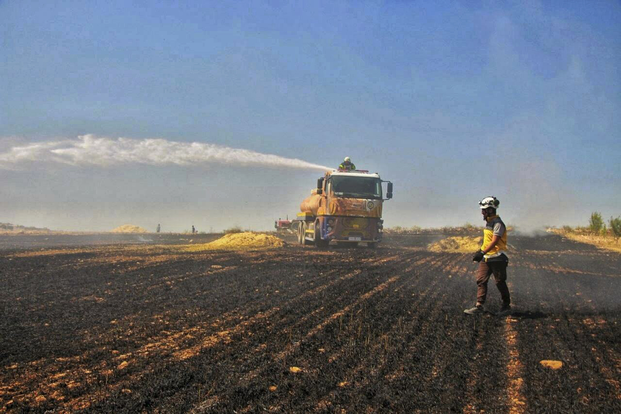 Crop fires, a weapon of war, ruin Iraqi, Syrian harvests