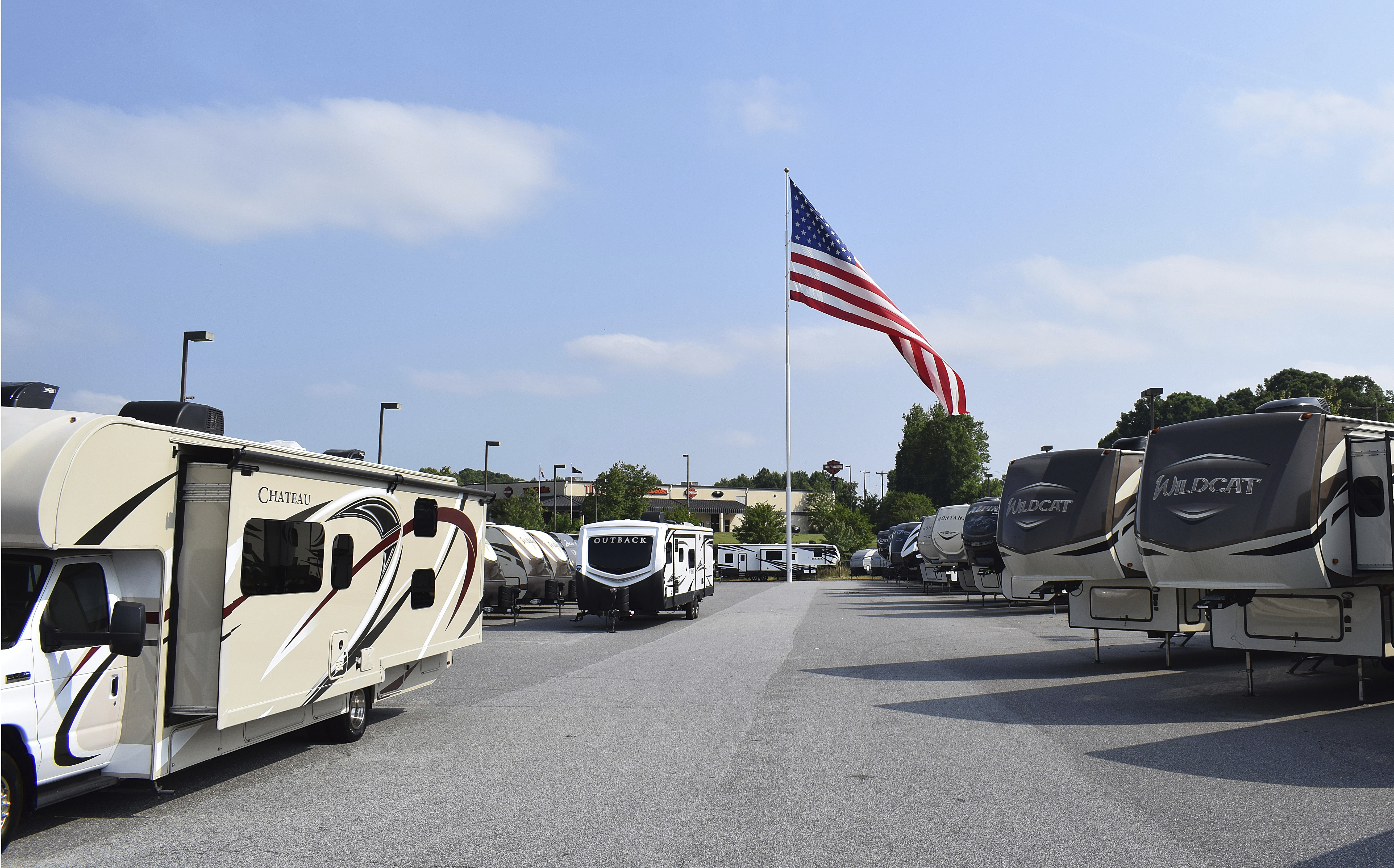 Giant American flag flap flutters on; business owner rallies