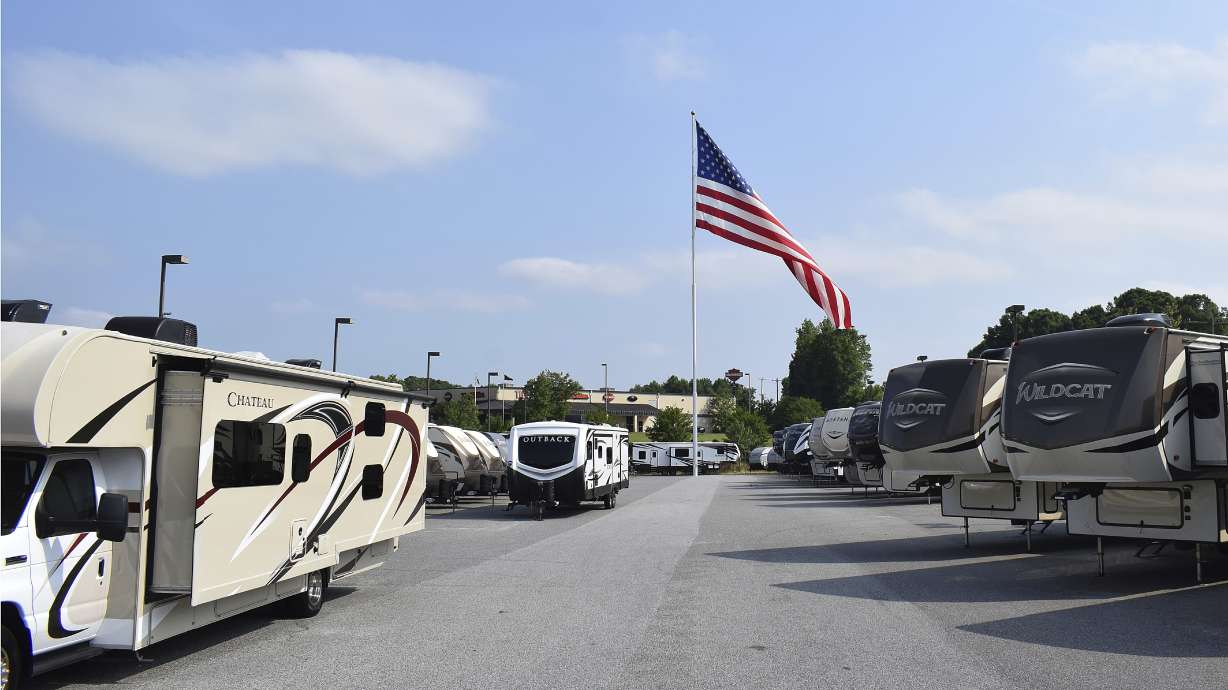 Giant American flag flap flutters on; business owner rallies