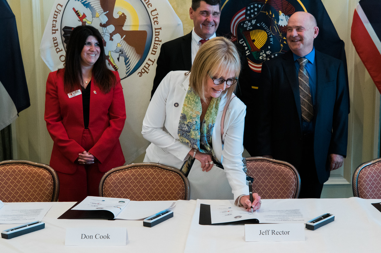 Laura Nelson, director of the Utah Governor's Office of Energy Development, signs a memorandum of understanding on Thursday, May 30, 2019, that could potentially open up liquified natural gas exports to foreign markets. (Photo: Governor's Office of Energy Development)