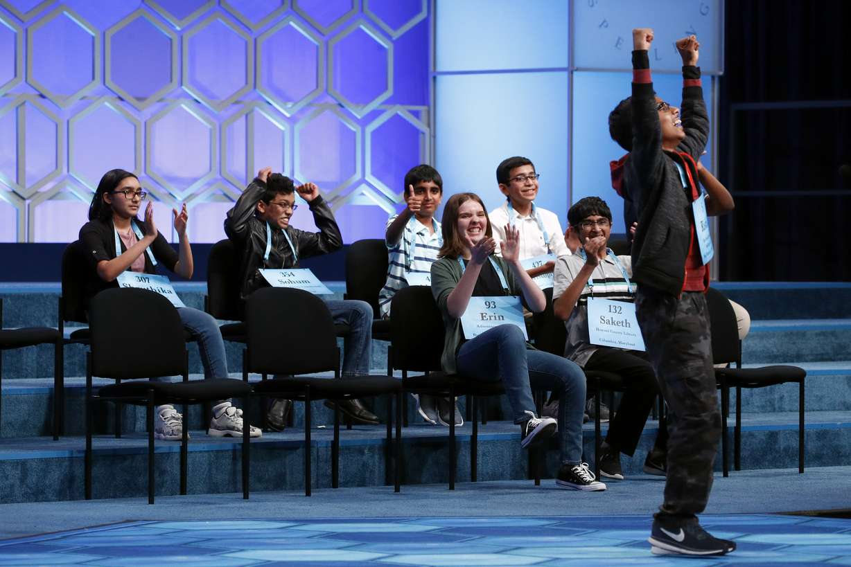 Rishik Gandhasri, right, 13, of San Jose, Calif., celebrates after becoming one of eight co-champions in the finals of the Scripps National Spelling Bee, Friday, May 31, 2019, in Oxon Hill, Md. Photo: AP Photo